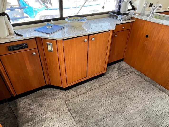  Yacht Photos Pics Interior of 1996 Bayliner 3788 Command Bridge Motoryacht with wooden cabinets and granite countertop.
