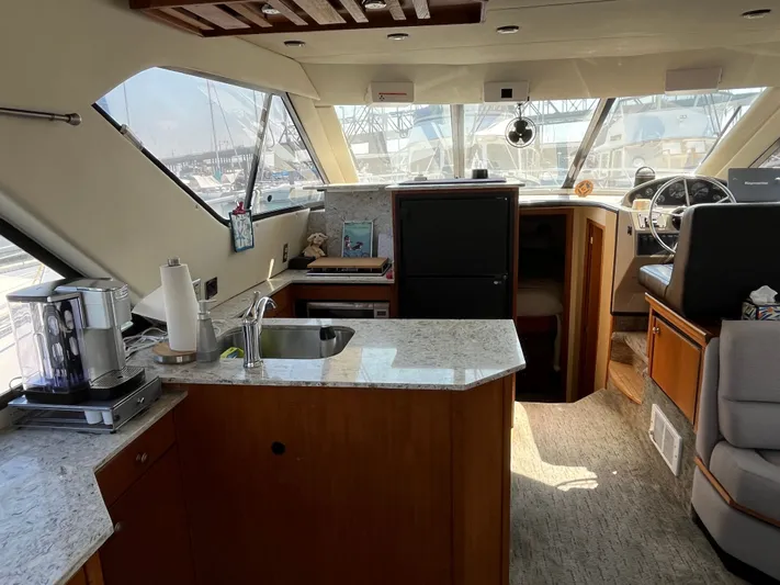  Yacht Photos Pics Interior of 1996 Bayliner 3788 Command Bridge Motoryacht with modern kitchen and helm.