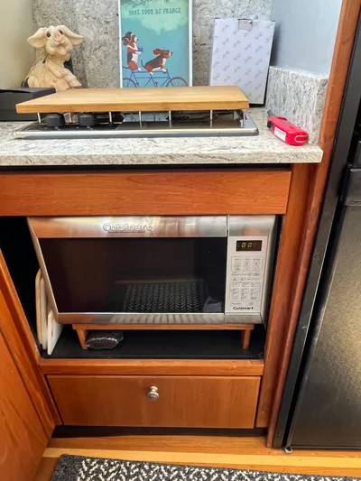  Yacht Photos Pics Kitchen area in a 1996 Bayliner 3788 yacht with microwave and stove.