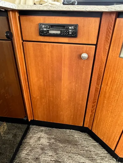  Yacht Photos Pics Wooden cabinet with built-in stereo on a 1996 Bayliner 3788 Command Bridge Motoryacht.