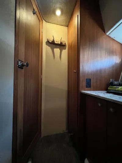  Yacht Photos Pics Interior of 1996 Bayliner 3788 Command Bridge Motoryacht with wooden cabinetry and soft lighting.