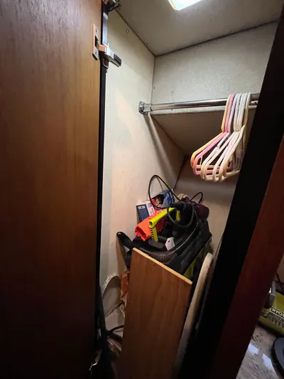  Yacht Photos Pics Closet interior on 1996 Bayliner 3788 Command Bridge Motoryacht with hangers and miscellaneous items.