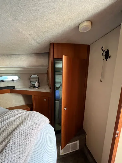  Yacht Photos Pics Interior of 1996 Bayliner 3788 Command Bridge Motoryacht with wooden cabinetry and cozy decor.