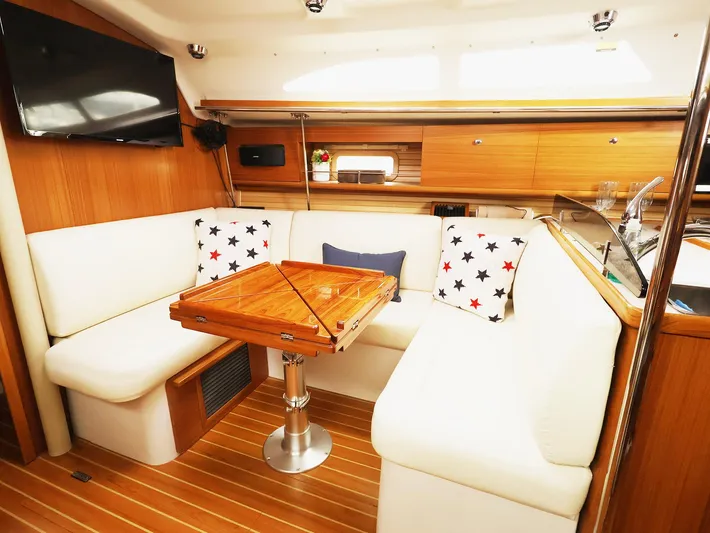  Yacht Photos Pics Interior of 2021 Catalina C355 yacht with cozy seating and wooden table.