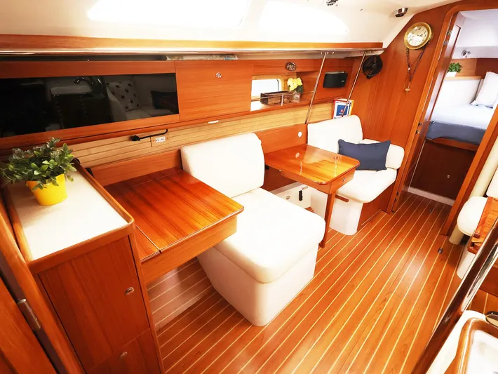  Yacht Photos Pics Luxurious interior of 2021 Catalina C355 yacht with wooden finish and comfortable seating.