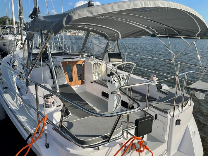  Yacht Photos Pics 2021 Catalina C355 sailboat with canopy, docked on a sunny day.