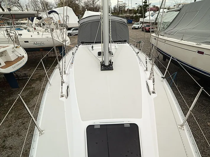  Yacht Photos Pics 2021 Catalina C355 sailboat deck view in marina, surrounded by other boats.