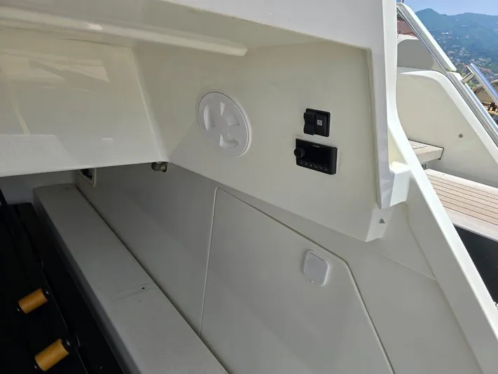 Yacht Photos Pics 2023 Cranchi Sessantasette 67 yacht interior detail with control panel and seating area.