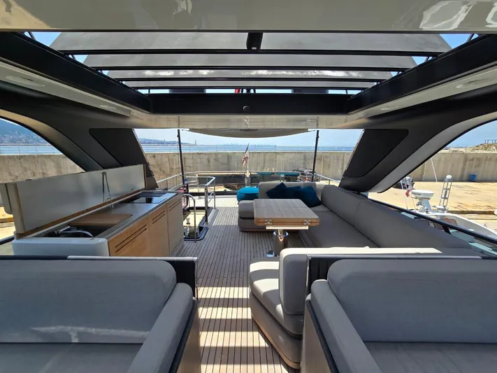  Yacht Photos Pics 2023 Cranchi Sessantasette 67 yacht interior with modern seating and open deck view.