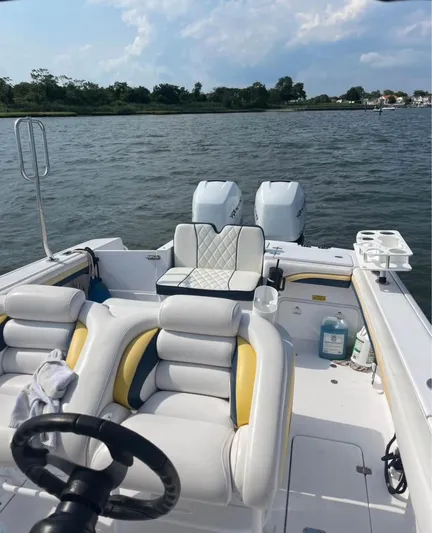  Yacht Photos Pics 2004 Donzi 35 ZF boat with dual engines on a calm lake.