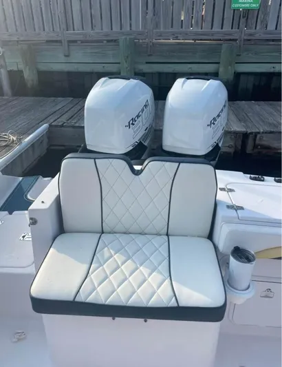  Yacht Photos Pics 2004 Donzi 35 ZF boat with dual outboard engines and cushioned seating.