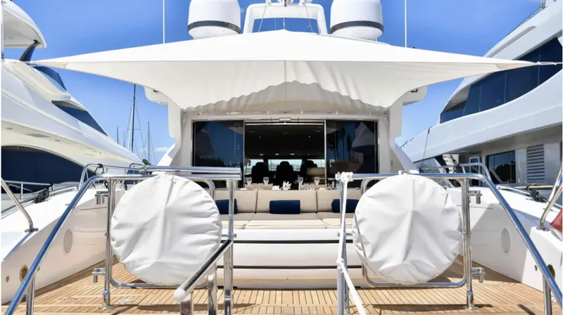  Yacht Photos Pics Luxury 2009 Mangusta 92 yacht with spacious deck and elegant seating area.