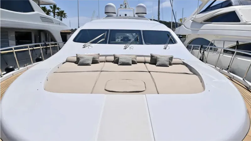  Yacht Photos Pics Luxurious 2009 Mangusta 92 yacht with spacious sunbathing deck and plush cushions.