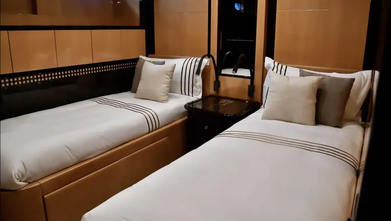  Yacht Photos Pics Luxurious twin bedroom in 2009 Mangusta 92 yacht with modern decor and elegant bedding.