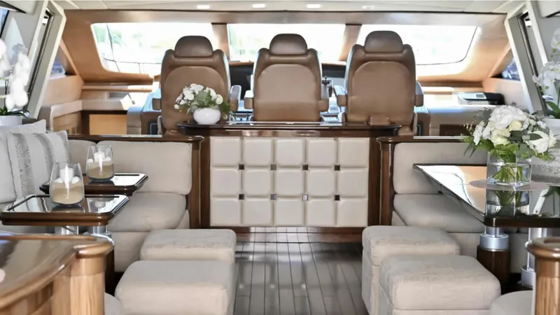  Yacht Photos Pics Luxurious interior of a 2009 Mangusta 92 yacht with elegant seating and decor.