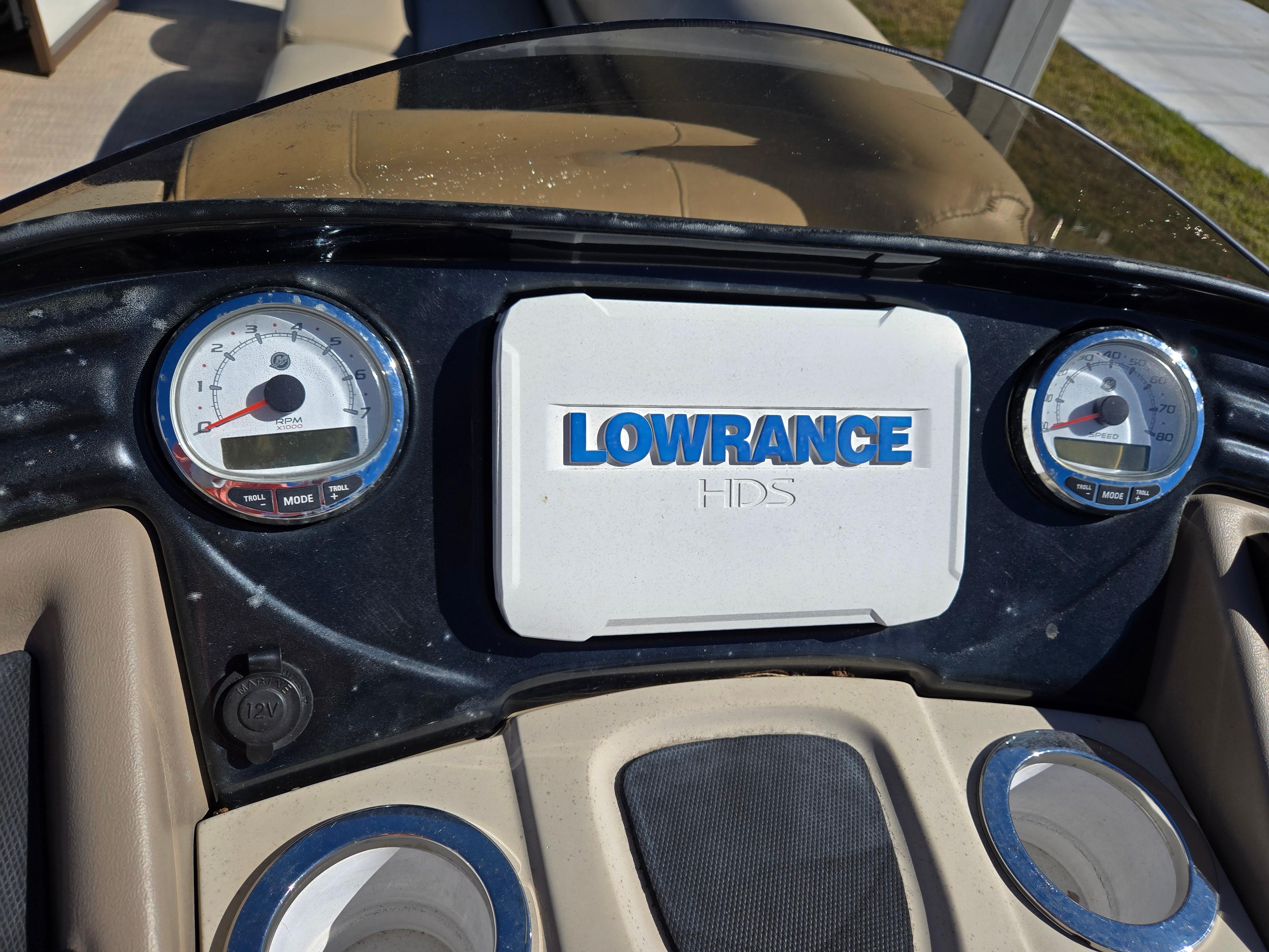 Dashboard of 2017 Regency 254 LE3 with Lowrance HDS system and gauges.