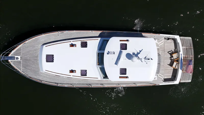 Ballena Yacht Photos Pics Overhead view of 2002 Grand Banks 49 Eastbay HX yacht on water.