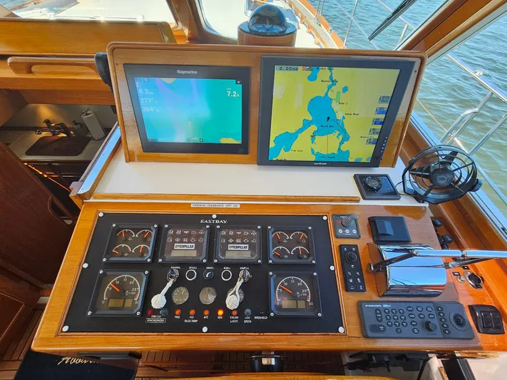 Ballena Yacht Photos Pics Control panel of 2002 Grand Banks 49 Eastbay HX with navigation screens and gauges.