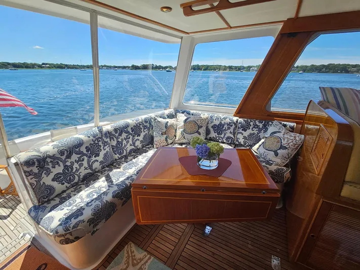 Ballena Yacht Photos Pics Luxurious 2002 Grand Banks 49 Eastbay HX yacht interior with elegant seating and scenic water view.