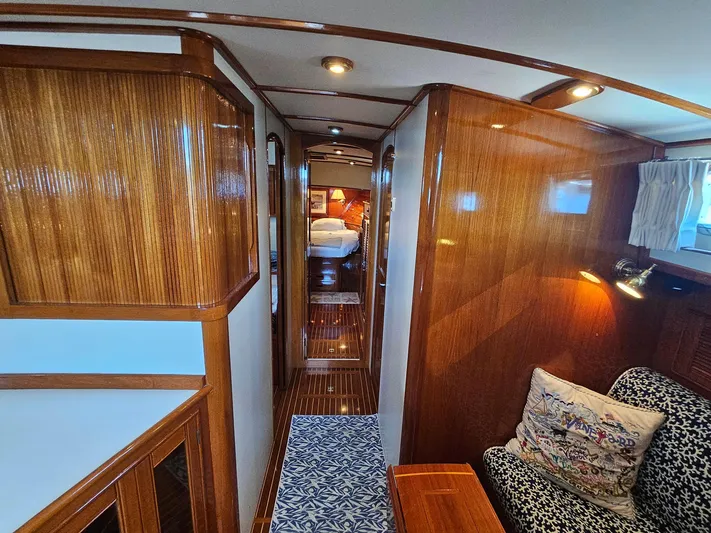 Ballena Yacht Photos Pics Luxurious 2002 Grand Banks 49 Eastbay HX yacht interior with polished wood and cozy seating.