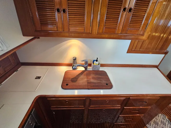 Ballena Yacht Photos Pics Luxurious wooden kitchen interior of 2002 Grand Banks 49 Eastbay HX yacht.