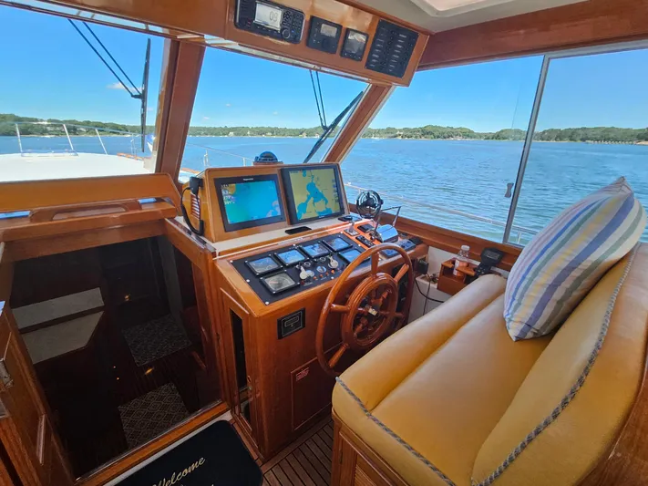 Ballena Yacht Photos Pics Interior of 2002 Grand Banks 49 Eastbay HX yacht with navigation equipment and scenic water view.
