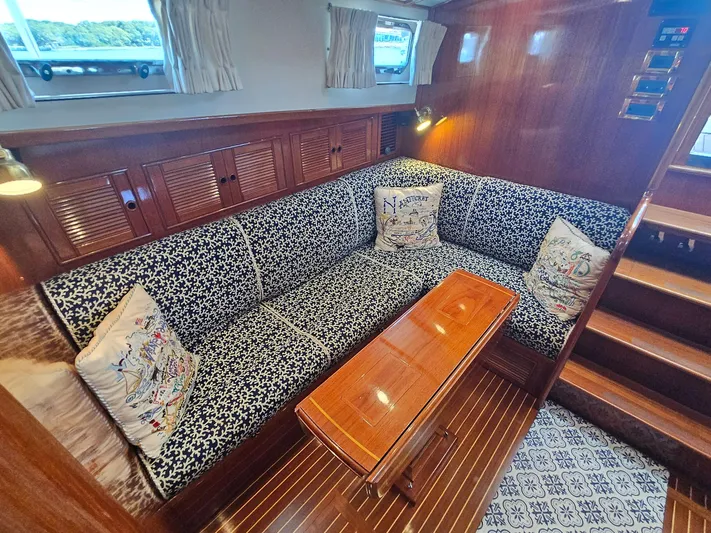 Ballena Yacht Photos Pics Luxurious 2002 Grand Banks 49 Eastbay HX yacht interior with elegant seating and wooden finishes.