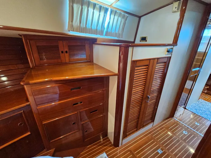 Ballena Yacht Photos Pics Luxurious wooden interior of 2002 Grand Banks 49 Eastbay HX yacht cabin.