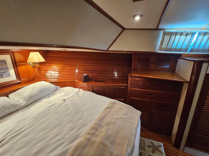 Ballena Yacht Photos Pics Luxurious cabin interior of 2002 Grand Banks 49 Eastbay HX yacht with wooden furnishings.