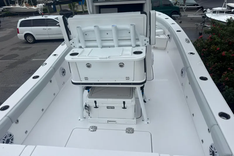  Yacht Photos Pics 2026 Blackfin 262 HB boat interior with fishing rod holders and Yeti cooler.