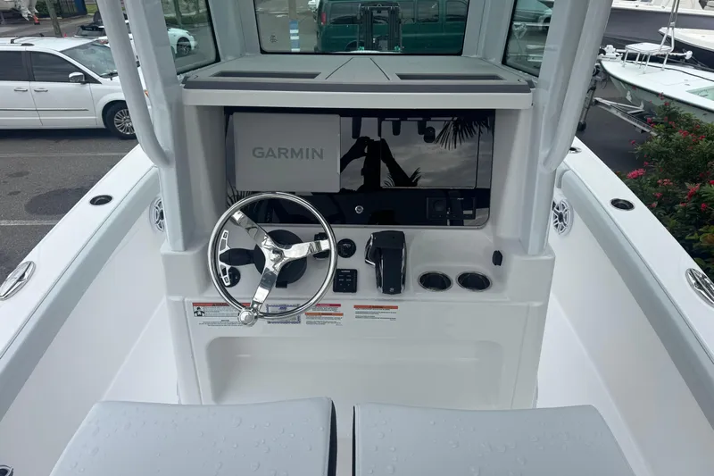  Yacht Photos Pics 2026 Blackfin 262 HB boat helm with Garmin navigation system and steering wheel.