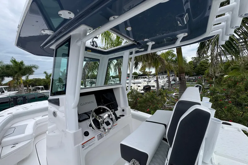  Yacht Photos Pics 2026 Blackfin 262 HB boat interior with Garmin navigation, sleek design, and comfortable seating.