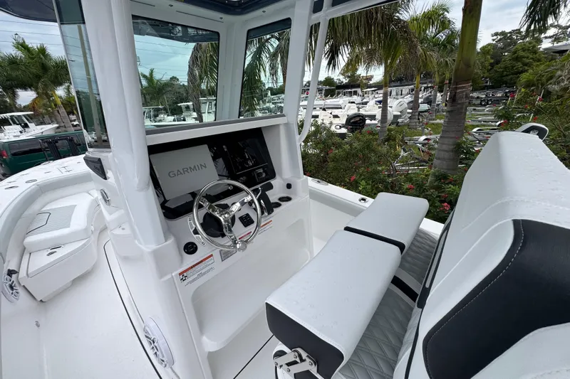  Yacht Photos Pics 2026 Blackfin 262 HB boat interior with Garmin navigation, sleek design, and comfortable seating.