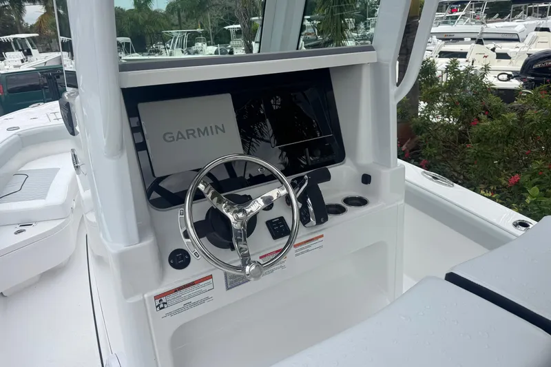  Yacht Photos Pics 2026 Blackfin 262 HB boat dashboard with Garmin navigation system and steering wheel.