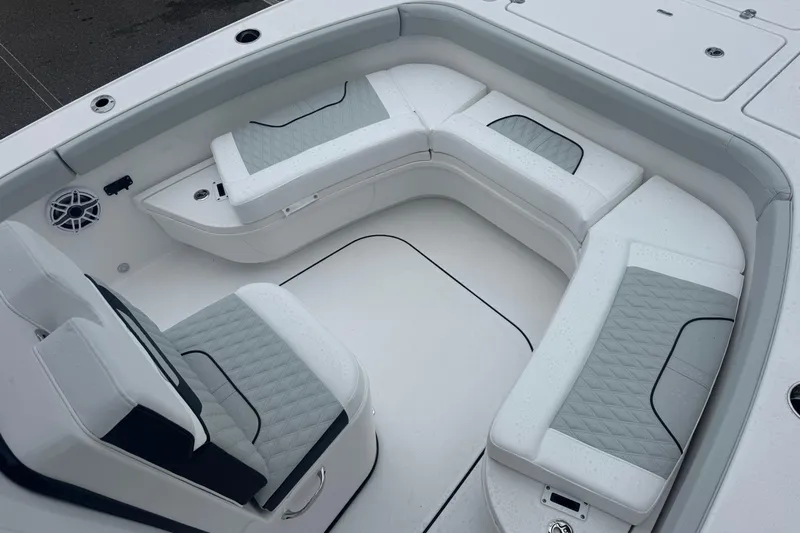  Yacht Photos Pics 2026 Blackfin 262 HB boat interior with cushioned seating and sleek design.