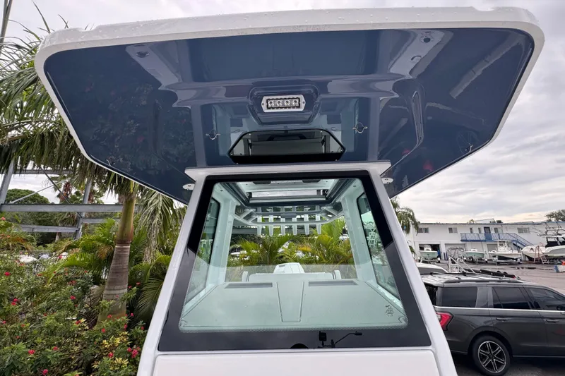  Yacht Photos Pics 2026 Blackfin 262 HB boat with sleek design, viewed from below the hardtop.
