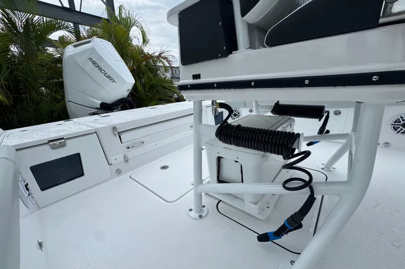  Yacht Photos Pics 2026 Blackfin 262 HB boat deck with Mercury engine and seating area.