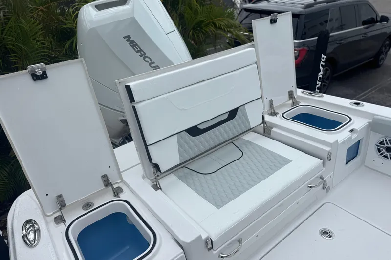  Yacht Photos Pics 2026 Blackfin 262 HB boat interior with storage compartments and Mercury engine.