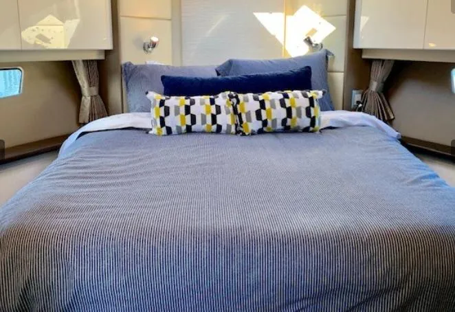  Yacht Photos Pics Luxurious bedroom interior of 2016 Carver C37 yacht with stylish bedding and decor.