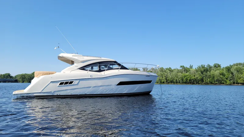  Yacht Photos Pics 2016 Carver C37 yacht on a calm lake under clear blue sky.