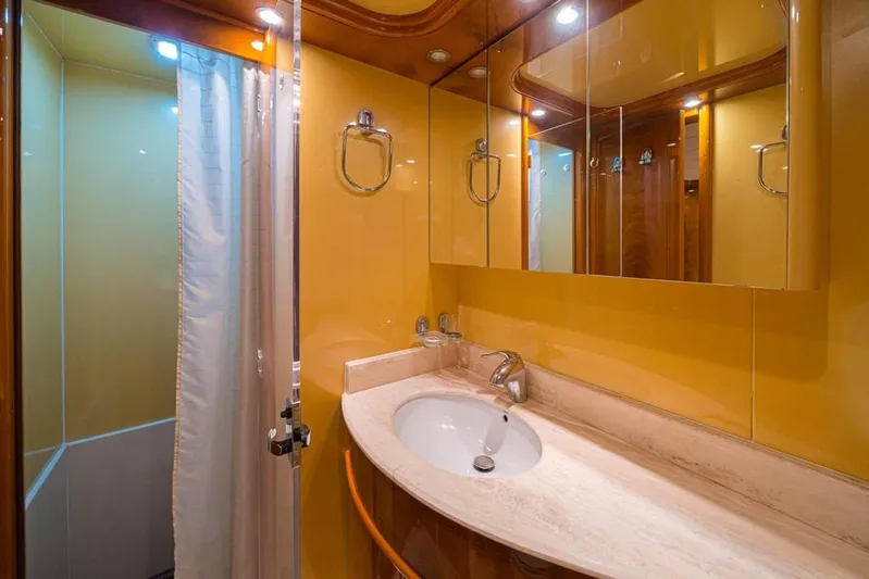  Yacht Photos Pics Luxurious bathroom on 2000 Astondoa 82 GLX yacht with elegant fixtures and mirrored cabinets.