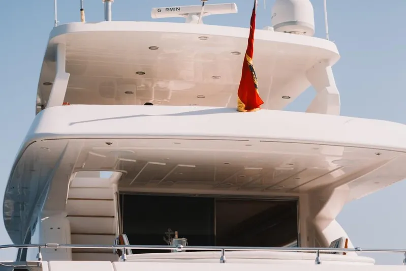  Yacht Photos Pics Astondoa 82 GLX yacht, 2000 model, featuring sleek design and upper deck with flag.