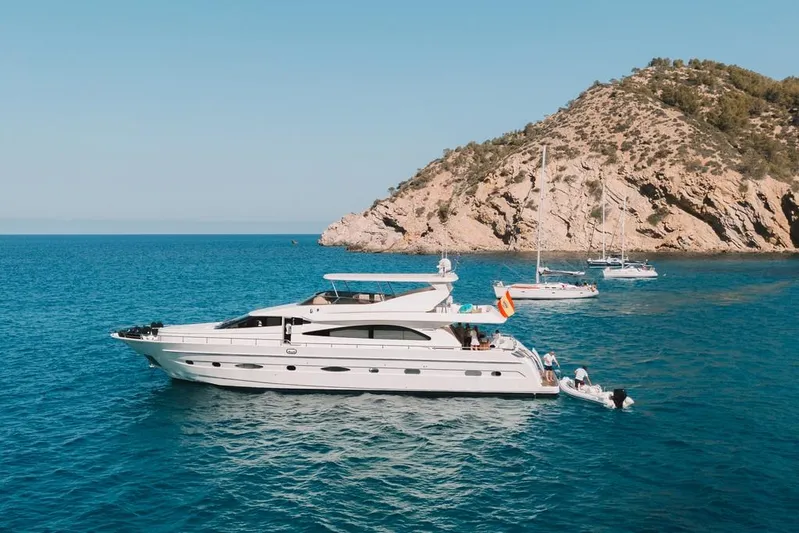  Yacht Photos Pics Luxury Astondoa 82 GLX yacht cruising near rocky coastline, 2000 model.