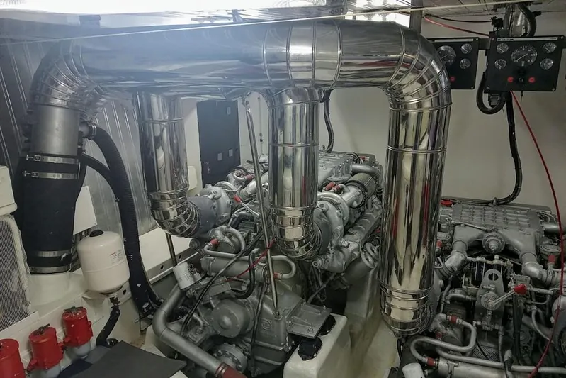  Yacht Photos Pics Engine room of 2000 Astondoa 82 GLX yacht with polished exhaust pipes.