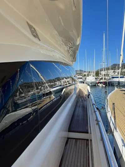  Yacht Photos Pics 2016 Ferretti Yachts 750 docked, reflecting marina view on sleek exterior.