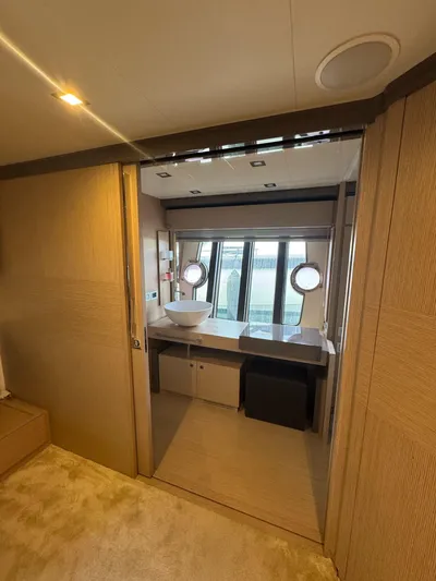 Yacht Photos Pics Luxurious bathroom interior of 2016 Ferretti Yachts 750 with modern fixtures and porthole windows.