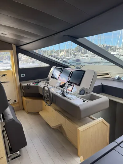  Yacht Photos Pics Luxurious 2016 Ferretti Yachts 750 helm with modern navigation systems and marina view.