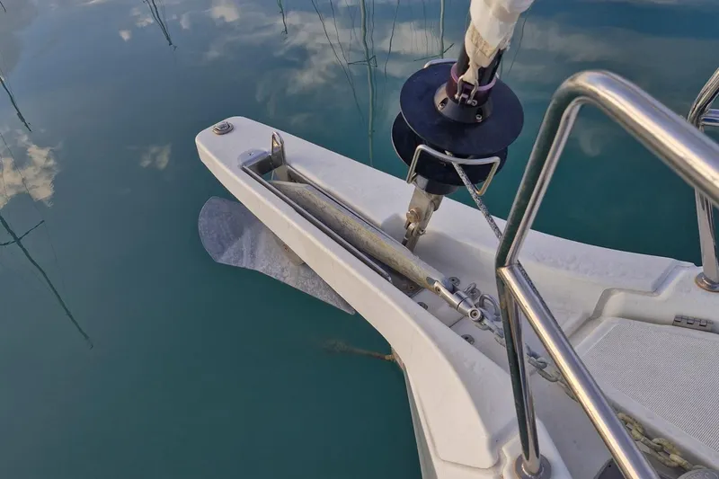 Dreamcatcher II Yacht Photos Pics Jeanneau Sun Odyssey 440 (2019) anchor and bow detail on calm water.