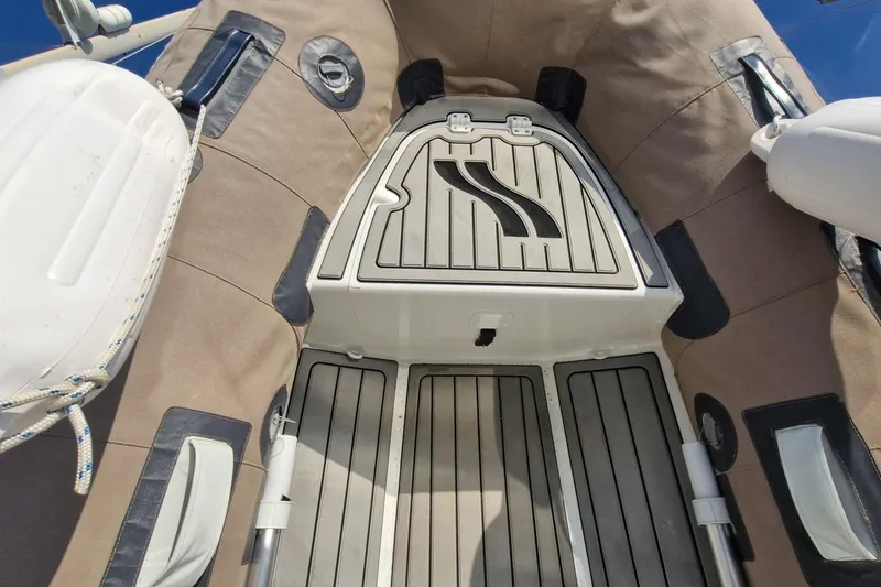 Dreamcatcher II Yacht Photos Pics 2019 Jeanneau Sun Odyssey 440 deck with cushioned seating and storage compartments.