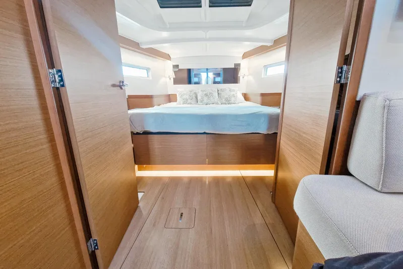 Dreamcatcher II Yacht Photos Pics Luxurious interior cabin of 2019 Jeanneau Sun Odyssey 440 yacht with cozy bed.